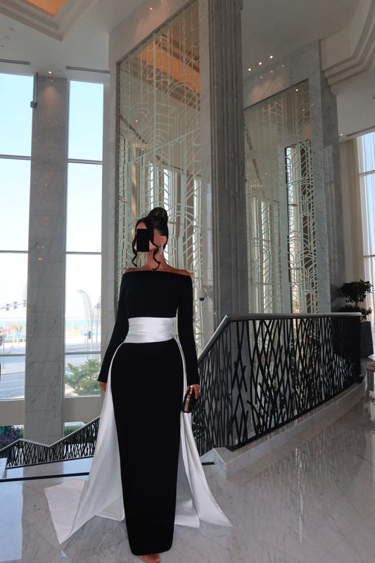 OFF SHOULDER FITTED DRESS WITH DRAPE AND TRAIL