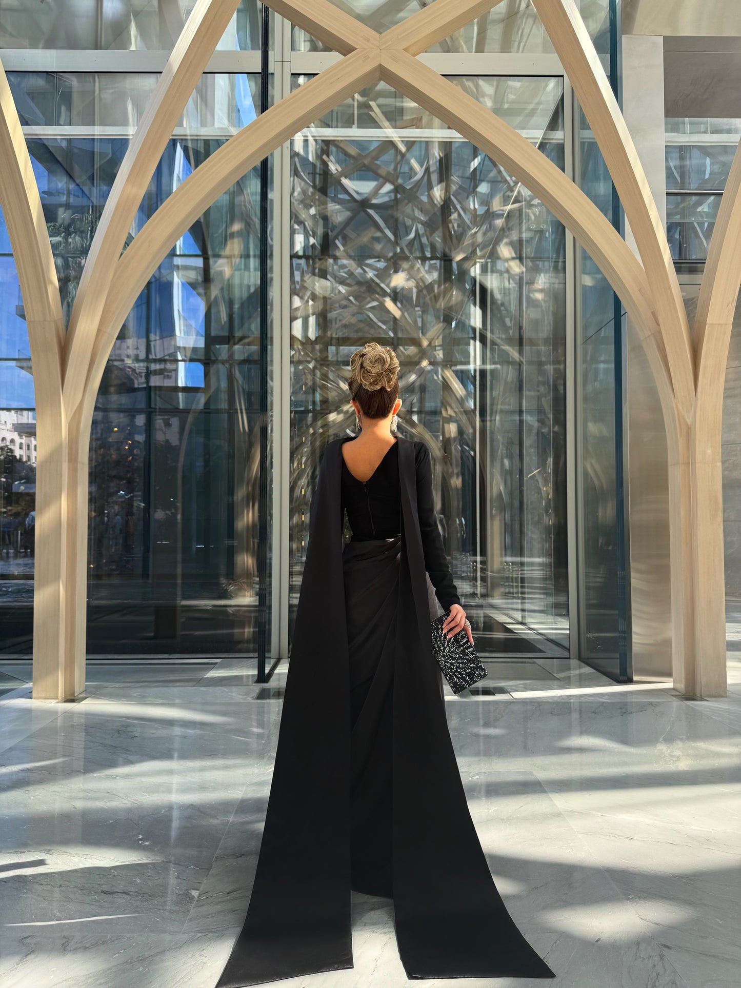 BLACK CREPE AND SATIN SEMI FITTED DRESS WITH DRAPED OVERLAY